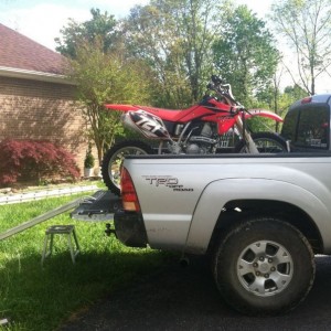 Bamf tie downs work great. Oem flexted to much tiing the bike down.