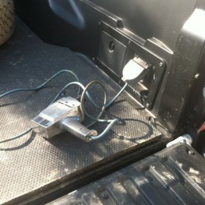 Using the truck to power the drill, to drill a hole in the truck.