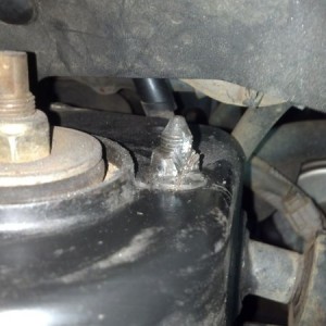 Little fucker...didn't cut into the shock tower, Thats just glare from