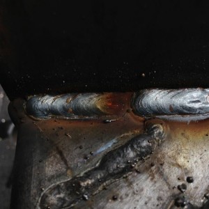 Weld below with flux wire no gas Upper weld with gas What a difference