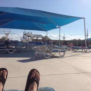 Relaxing by the pool after jumping off the diving board for about an hour h