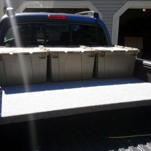 2013 DCLB, carpeted bed deck with storage bins.