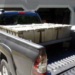 2013 DCLB, carpeted bed deck with storage bins.