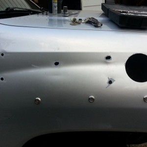 I put primer around the holes to prevent rust. Looks good... Kinda. 3 holes