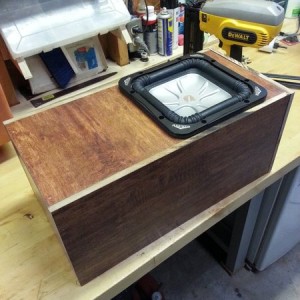 Built a fancy-ass sub box out of scrap laminate flooring material. Still ne