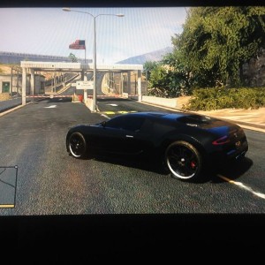 Taking my bulletproof Bugatti through the base on GTA 5 haha