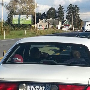 Douchebags oof the year award. Two dirty white thugs smoking with a baby in