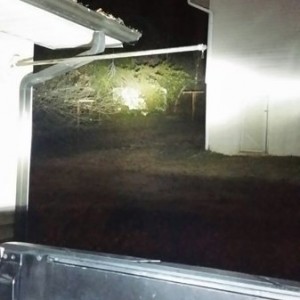 That building in the pic behind that house is about 70 yards away