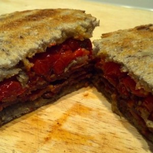 Bacon and fried tomato on buttered sourdough walnut wheat toast. Bitches.