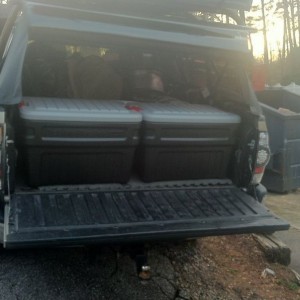 Action packers! 2 24 gallons fill the bed perfectly. Gotta get two 48s next