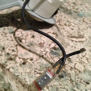 Took apart a canned light. Anyone know what that little metal thing covered