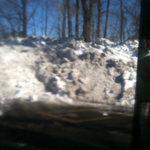 Snow piled up after hauling it out of town 15 ft tall about 100 ft long