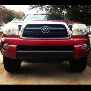 Red tacoma with black fender flares