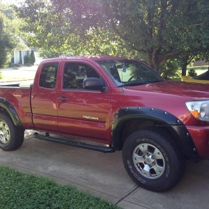 Red tacoma with black fender flares