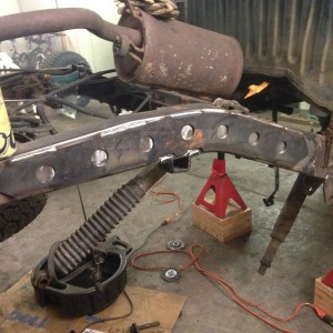 Welding on new spring hangers and frame plates for Nate.