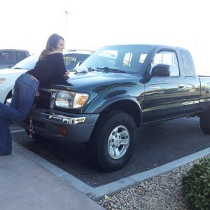 my chick leaning on my stock truck