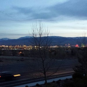 Out grilling on the balcony. Overlooking Reno city lights and sunset over t
