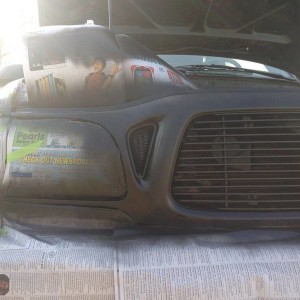 Right headlight taped up for plasti dipping