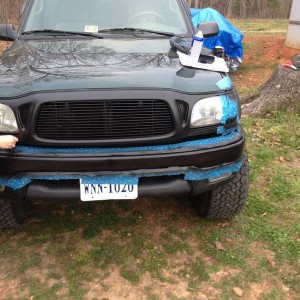 First coat on bumper and left turn signal trims and taping up right turn si