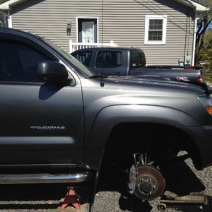 Lifting the neighbor's truck.