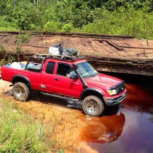 Tacoma offroad muddy dirty river crossing