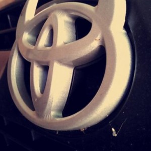 Toyota devil horns emblem mounted on factory 4runner grill