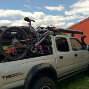 How about this... sideways fork mount on the bed rail and find something to
