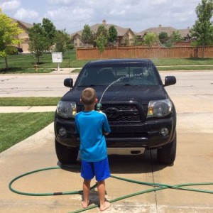 Nephew washing the truck.