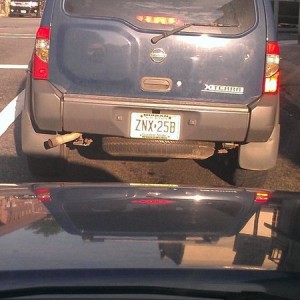 Typical moron. Brake light out and dangling spare ready to kill someone. I 