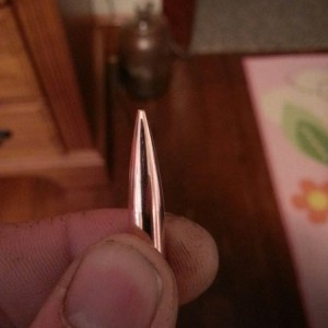 Its a Berger 105gr VLD Hunting bullet. Jacket has imperfections/furrows alo
