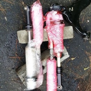 Soaking coilovers in rust remover