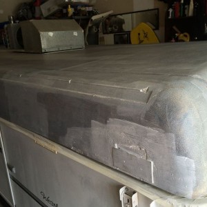 1 coat of elastomeric rubberized sealer/primer....need at least 2 more