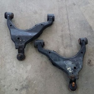 For sale: factory lower control arms, one bushing removed. Also have the ba