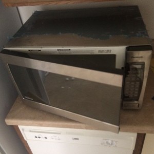 New microwave came! Too bad fedex dropped something on it and now the door 
