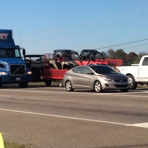 Someone double towing 2 trailers with utvs.