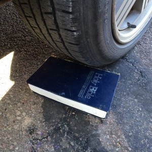 Using a bible as a wheel chock