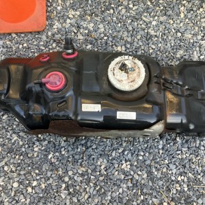 Fuel tank with pump and hanger assembly