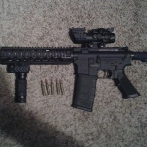 Im into this $820. Flashlight grip, green lazer on the other side, and a ch
