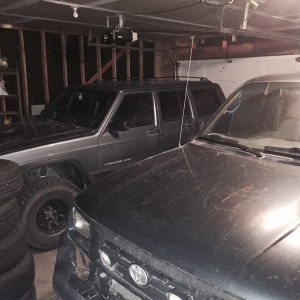 A jeep has joined sluggo in the garage for the weekend