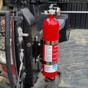 bed-mounted fire extinguisher quick release