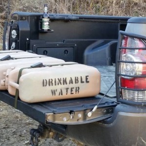 Scepter jerry cans mounted with 48" straps.