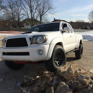 Stealth Custom Series SR8 16x8s with Nitto TerraGrapplers on stock suspensi
