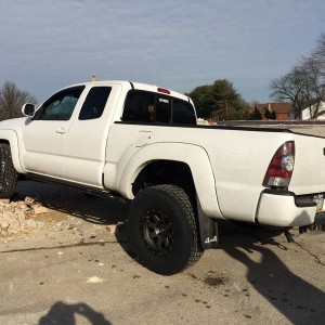 Stealth Custom Series SR8 16x8s with Nitto TerraGrapplers on stock suspensi