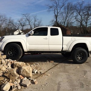 Stealth Custom Series SR8 16x8s with Nitto TerraGrapplers on stock suspensi