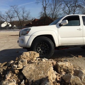 Stealth Custom Series SR8 16x8s with Nitto TerraGrapplers on stock suspensi