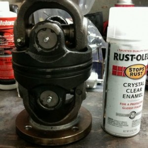 New front drive line CV next to a 12oz spray paint can