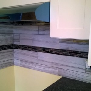 New backsplash and liner in at the rental. One more thing checked off the l