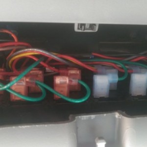 Switch panel wiring behind sunglass holder