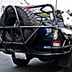 My new brute force high clearance tube bumper with swing down tire carrier.