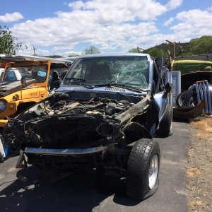 One very wrecked Toyota.